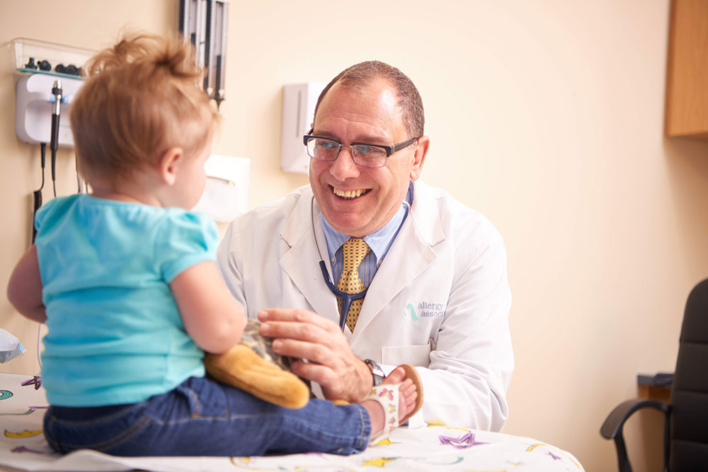 Dr. Theodoropolous with a toddler patient