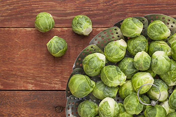 Glucosinolate, a natural component of Brussels sprouts and other vegetables in the cruciferous family, has been associated with a decreased risk of cancer, including lung, stomach, and colon cancers.