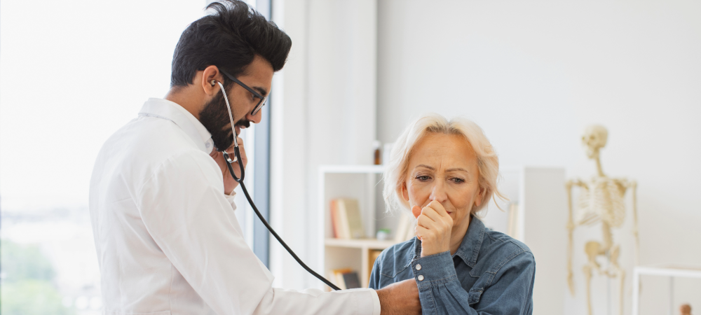doctor with a coughing woman