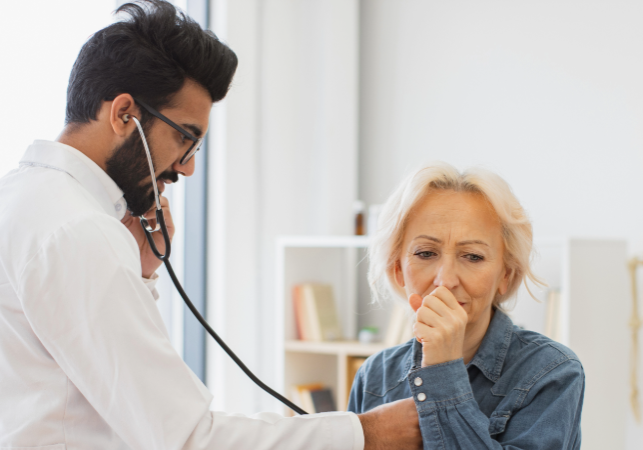 doctor with a coughing woman